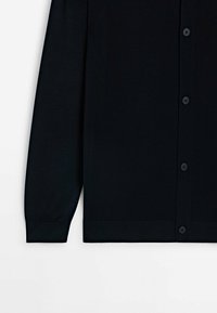 Black cardigan with long sleeves, made from a smooth textured fabric, featuring a buttoned front and ribbed cuffs and hem.