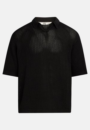 Black short-sleeve knitted polo shirt featuring a textured open weave pattern and a classic collar. Minimalistic design with straight hem.