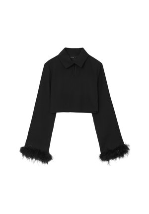 Black cropped top with long sleeves, collared neck, and textured feather trim at sleeve hems. Smooth fabric with a sleek silhouette.