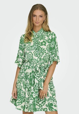 Green and white floral-patterned dress featuring short sleeves, a button-down collar, and a tied waist, made from lightweight fabric.
