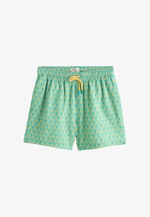 Turkusowe szorty kąpielowe z powtarzającym się żółtym motywem liści palmy i żółtym sznurkiem do wiązania w elastycznym pasie.