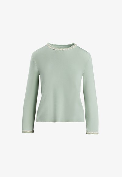 Gaiši zaļa garo piedurkņu blūze ar apaļu kakla izgriezumu. Strukturēts materiāls ar dekoratīvu apdari ap kakla un piedurkņu malām.