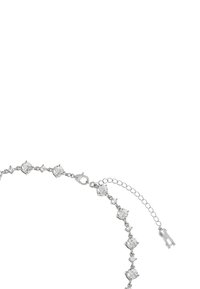 Silver chain bracelet featuring circular clear gemstones in varying sizes, with a lobster clasp and an adjustable chain extension.