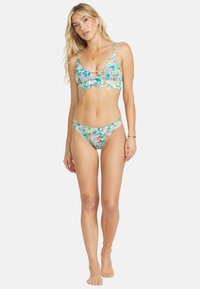 Floral print bikini set in blue, pink, and green with thin straps. Bikini top features a keyhole detail; bottoms are low-rise.