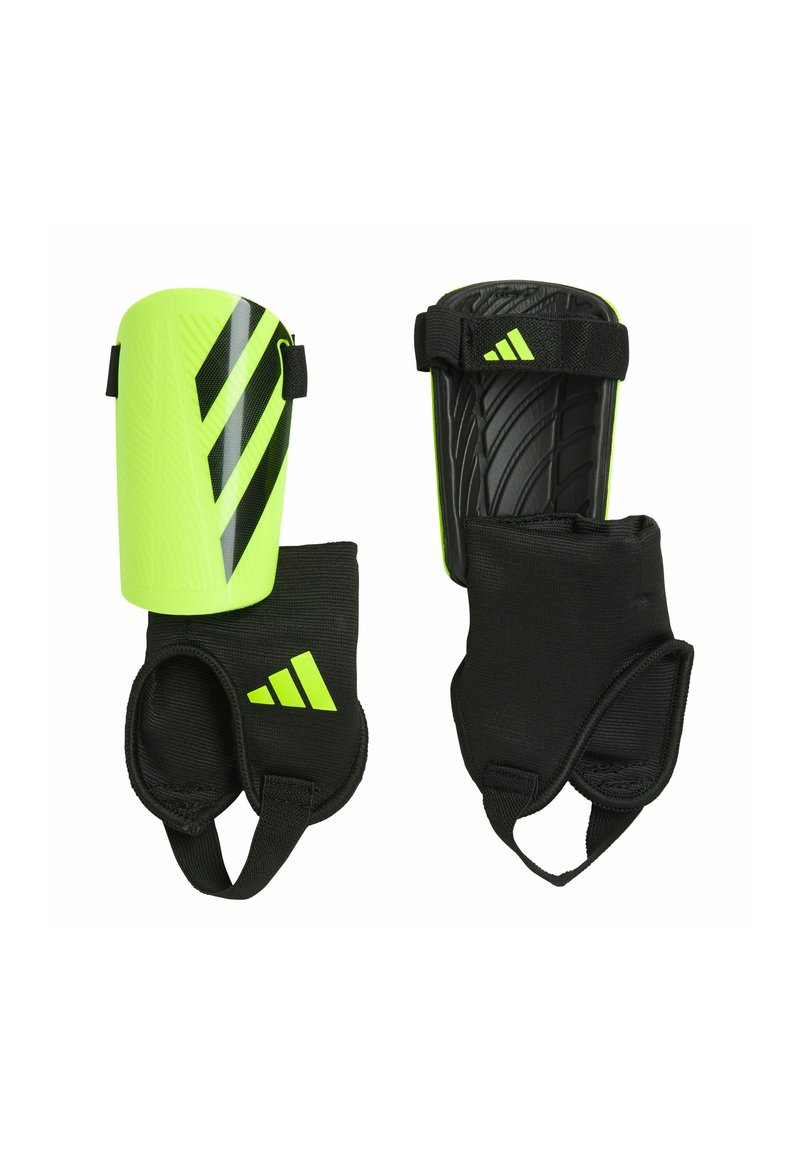 Espinilleras negras y amarillo brillante con correas ajustables. El exterior presenta una superficie texturizada y tres franjas diagonales.