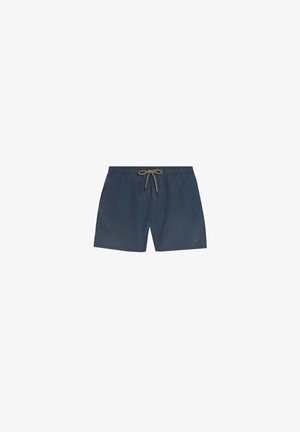 Costume da bagno blu navy con coulisse beige, vita elastica, tasche laterali e piccolo logo sulla gamba sinistra.