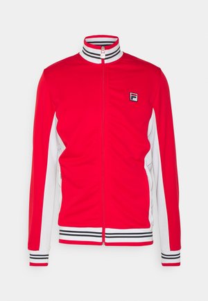 Rote Zip-Jacke mit weißen Seitenpanelen, gestreiftem Kragen und Bündchen. Besitzt ein kleines Logo auf der linken Brust und eine glatte Textur.