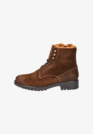 Braune Wildleder-Ankle Boots mit Futter aus Kunstfell, runder Zehenform und sechs Metallösen. Dicke Gummisohle mit Profil für besseren Halt.