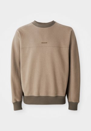 Beige crewneck sweatshirt with ribbed collar, cuffs, and hem, featuring subtle "BOSS" logo embroidered on the chest.