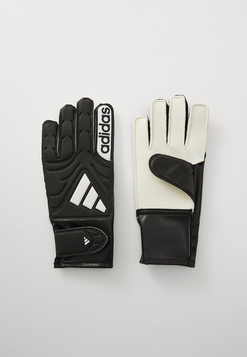 Svart och vit målvaktshandskar med texturerad svart handflata, slät vit baksida, Adidas-logotyp och justerbart handledsband.