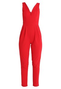 Tuta rossa con scollatura a V, design senza maniche, vita aderente e gambe affusolate. Realizzata in un tessuto morbido ed elastico, con pieghe laterali.