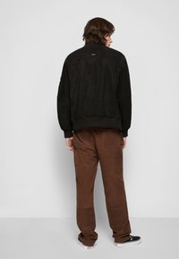 Deadwood COMBO - Casaco de couro - black