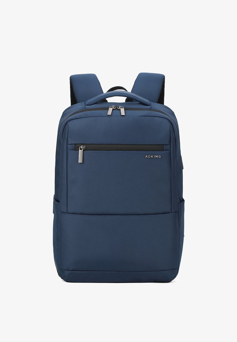 Zaino blu navy con superficie testurizzata, due spallacci regolabili, una tasca anteriore con zip e un compartimento principale con doppia zip.