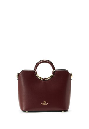 Sac à main en cuir bordeaux foncé avec des poignées supérieures arrondies et des accents dorés, petit logo doré près du bas au centre.