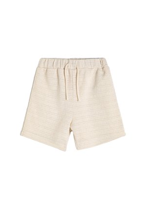 Pantalones cortos de tejido beige con cinturilla elástica y cordón de ajuste, que presentan un patrón texturizado y un corte relajado.