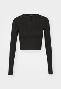 Must musta pikkade varrukatega crop top siledast kangast, millel on lipsuga kaelus ja struktureeritud õmblused, mis tagavad sobiva vormi.