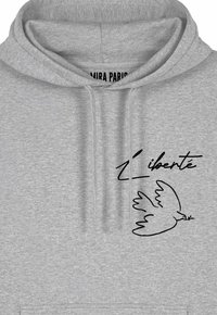 Felpa grigia con cappuccio e cordino, caratterizzata da un disegno a linea nera di una colomba e dalla scritta “L'liberté” in un font corsivo.