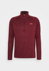 Maroon långärmad tröja med hög krage och kort dragkedja, med Under Armour-logotyp i orange. Tillverkad av strukturerad, ventilerande tyg.