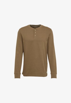 Langärmeliges Henley-Shirt in Khaki, aus weichem Baumwollmaterial. Verfügt über einen runden Halsausschnitt mit drei Knöpfen, gerippte Manchetten und einen geraden Schnitt.