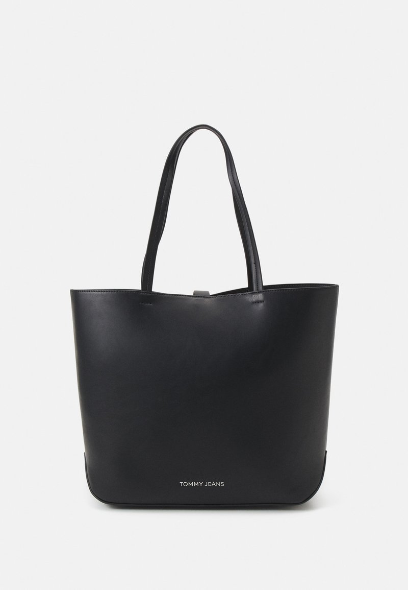 Black leather tote bag with two shoulder straps, smooth texture, minimalist design, and a logo in silver at the bottom.