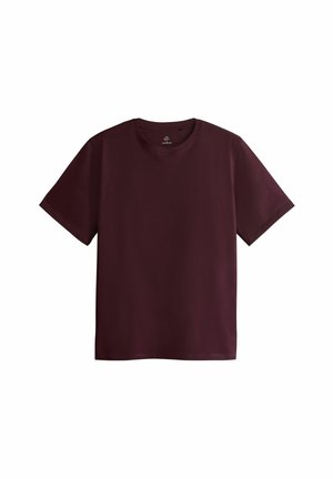 Bordeauxkleurig T-shirt gemaakt van zachte katoen. Beschikt over een klassieke ronde hals, korte mouwen en een rechte snit. Geen zichtbare patronen of logo's.