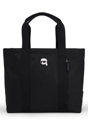 Sac fourre-tout noir avec deux poignées et un petit visage de dessin animé blanc portant des lunettes de soleil et une queue de cheval sur le devant.