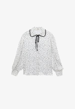 White blouse with black polka dots, featuring a rounded collar, black trim, and a tie closure, with long puffed sleeves and a button front.