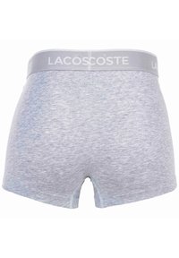 Herrboxer i ljusgrå bomullsmix; elastisk midjeband med "LACOSTE"-logotyp; slät textur och åtsittande form med benöppningar.