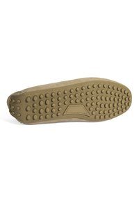 Schuhsohle aus strukturiertem Gummi, mit erhöhten Punkten und einem rautenförmigen Design. Die Farbe ist hellbeige mit glatten Kanten.