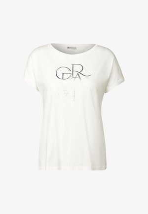 T-shirt en coton blanc à manches courtes, col rond, avec un design graphique en texte argenté. Texture douce et coupe décontractée.