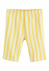 Leggings de algodón amarillo y blanco con un patrón de franjas onduladas, que cuentan con una cintura elástica y una textura suave. La longitud llega hasta la mitad de la pantorrilla.