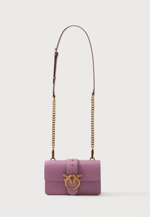Lilac leather shoulder bag with gold chain strap and gold clasp featuring two birds facing each other on front flap closure.