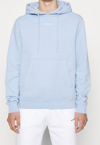 sandro Jersey con capucha - light blue