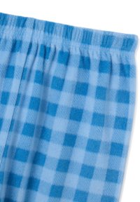 Pantalons de pyjama à carreaux bleus en polaire douce, avec une taille extensible et des carrés alternant entre bleu clair et bleu foncé.