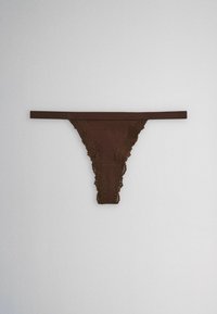 Brown lace-trimmed thong underwear with a thin waistband, laid flat on a plain light gray background.