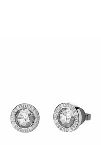 Zilveren studs met een heldere, facet geslepen kristallen center, omringd door een reliëf cirkelvormige rand met de tekst "GUESS".