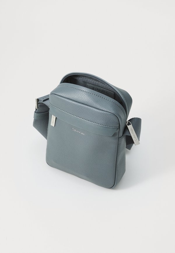 MUST REPORTER  - Cross body bag - turbulence2