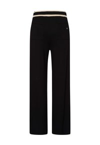Schwarze weite Hosen mit einem elastischen Bund in Schwarz und Creme mit Streifen, ausgestattet mit zwei Gesäßtaschen und einem sauberen Abschluss.