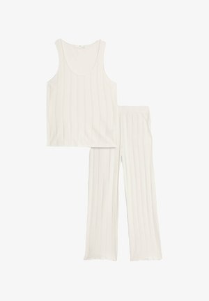 Biała bezrękawnik z pionowym prążkowanym wzorem w zestawie z luźnymi spodniami o dopasowanej talii, posiadającymi elastyczny pas i rozszerzonym krojem nogawek.