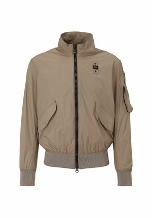 Beige bomber jacket with a high collar, front zip closure, two large side pockets, and one zippered arm pocket. Ribbed cuffs and hem.
