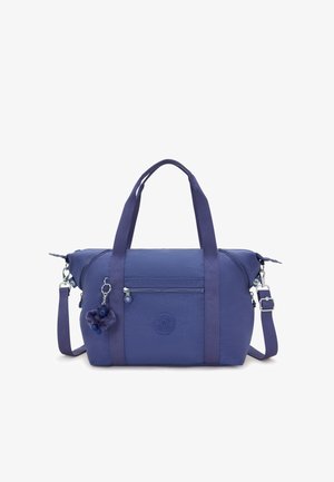 Violetti kangaskassi kaksinkertaisilla kahvoilla ja irrotettavalla olkahihnalla. Sisältää etupuolella vetoketjullisen taskun ja karvaisen avaimenperäkoristeen.