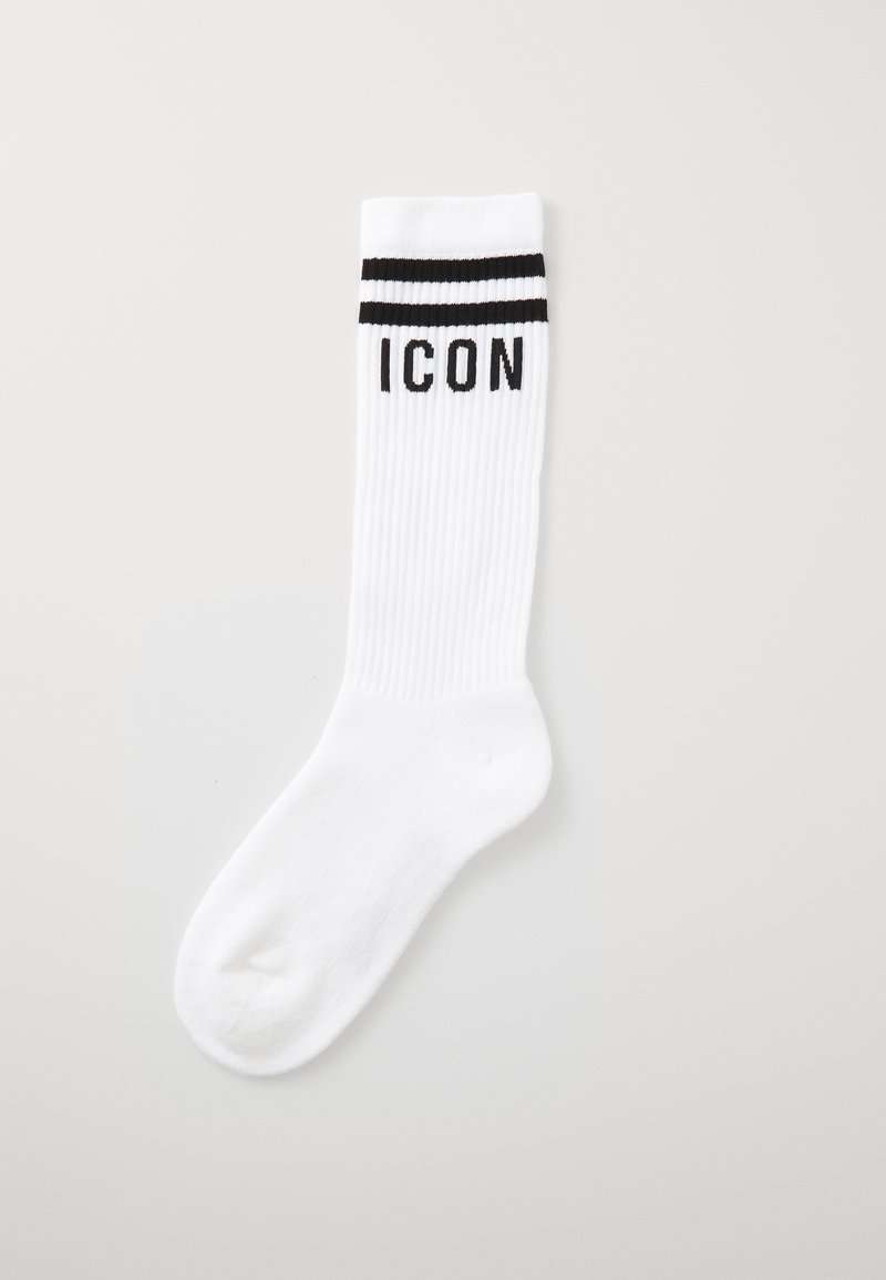 Chaussette blanche hauteur genou avec texture côtelée, présentant deux rayures horizontales noires en haut et le mot "ICON" en lettres noires.