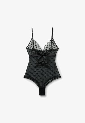 Sort gennemsigtig blondebody med hjerte mønstre, justerbare stropper og to satin sløjfer foran, med trykknapper i skridtet.