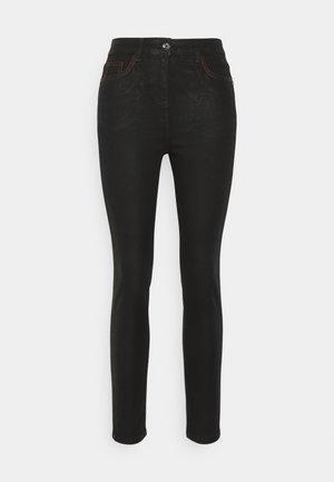 Black skinny jeans made of denim, featuring a front button closure, subtle orange stitching, and classic five-pocket design.