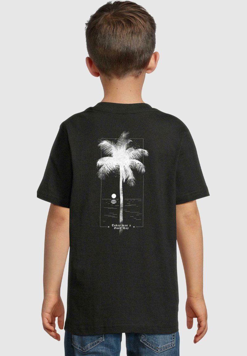 Black short-sleeve t-shirt with white palm tree and sunset graphic on the back. Features text: "Today was a Good Day" beneath the image.