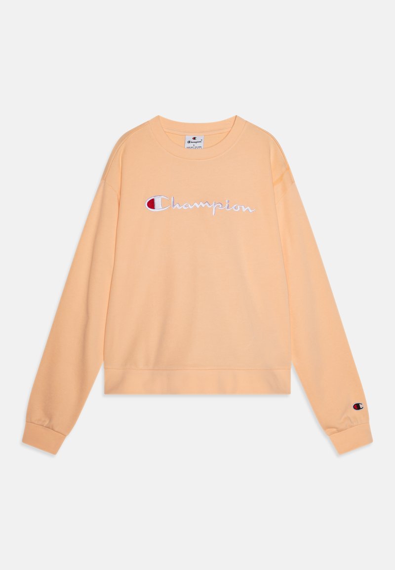 Persiku krāsu džemperis, izgatavots no kokvilnas, ar garām piedurknēm, apaļu izgriezumu un izšūtu "Champion" logo uz priekšpuses un piedurknes.