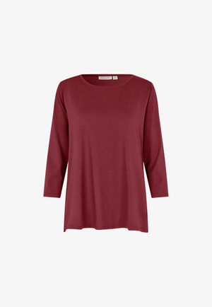 Maglietta a maniche lunghe color marrone con scollatura rotonda e vestibilità ampia. Realizzata in tessuto morbido con una sottile trama; nessun motivo o dettaglio visibile.