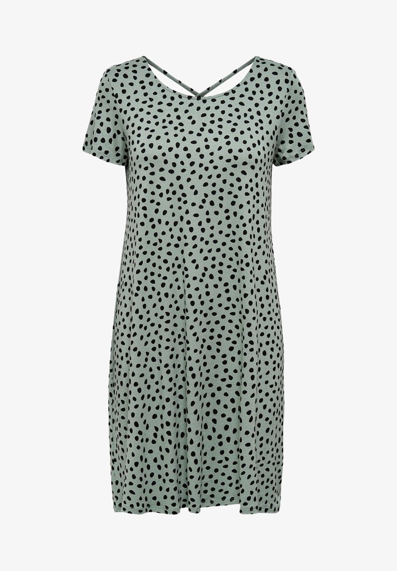 Robe courte à manches courtes de couleur vert clair avec un décolleté arrondi et un motif de pois noirs irréguliers, ample avec une jupe légèrement évasée.