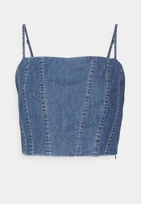 Farkkukangasinen crop top, jossa säädettävät spagettihihnat, muotoiltu istuvuus ja näkyvät ompeleet pystysuorien saumoissa. Vaaleansininen väri.