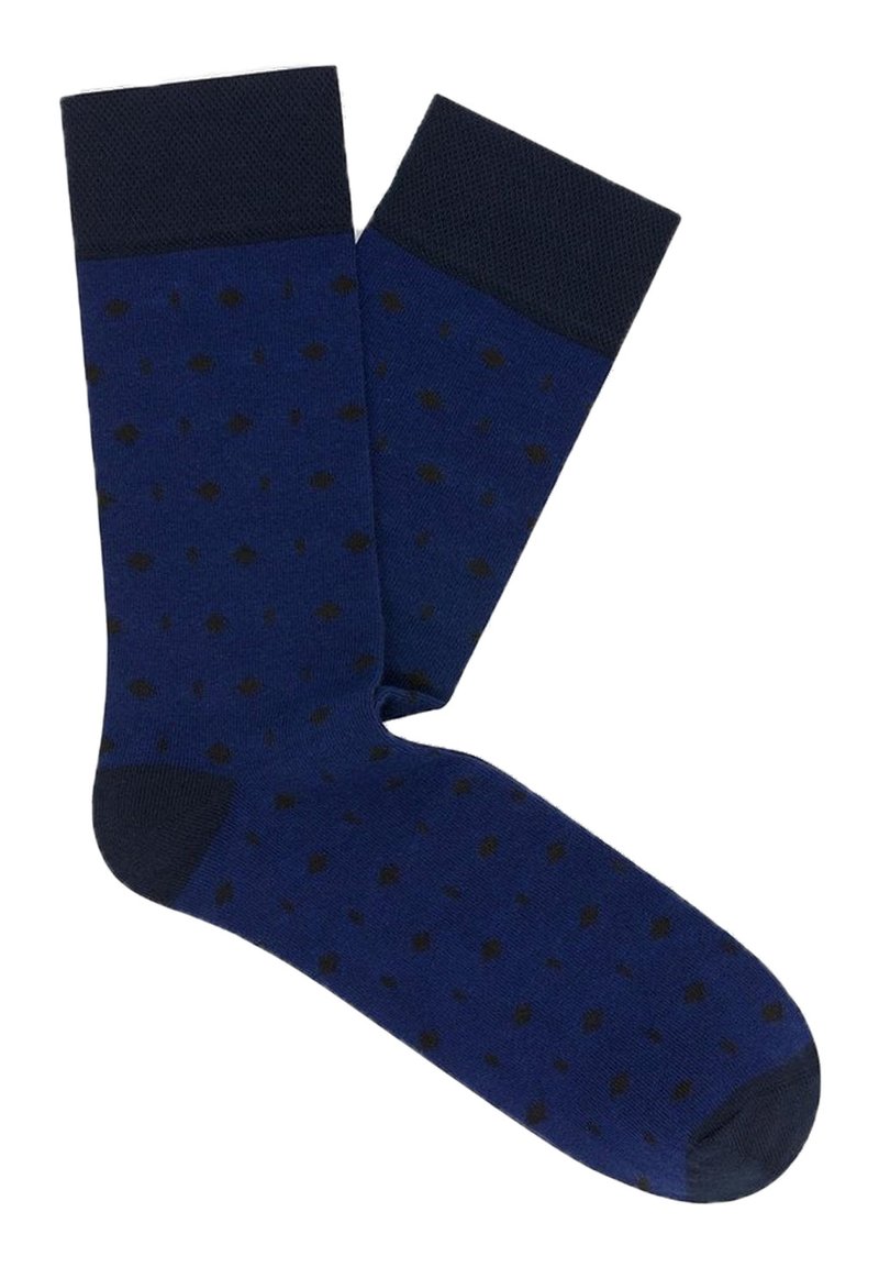 Granatowe skarpetki w kropki w ciemnym brązie. Posiadają jednolitą, ciemnoniebieską mankietę oraz gładką teksturę. Odpowiednie na oficjalne wyjścia.